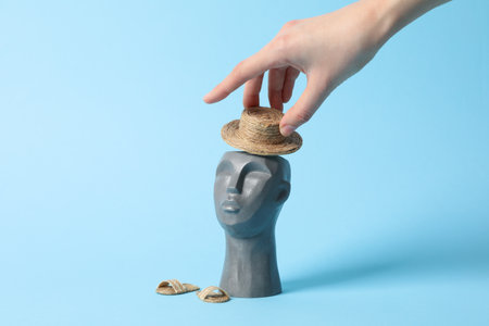 Vacation concept with decorative head on blue backgroundの写真素材