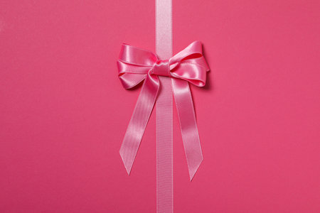Concept of different ribbons, pink ribbon on pink backgroundの写真素材