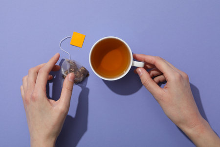 Hot drink to get warm - tea in cupの写真素材
