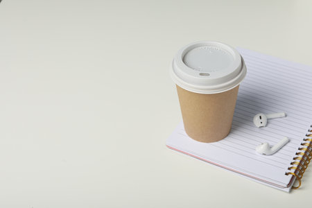 Concept of freelance, composition with hot drink and headphonesの写真素材