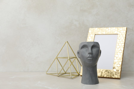 Decor concept with decorative head on light table