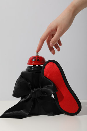Mask and bell for hand sex, side view