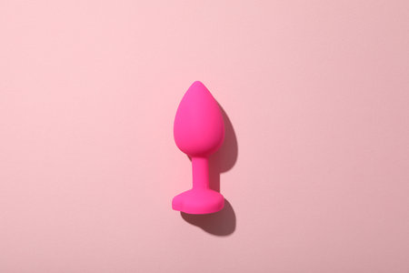 Pink butt plug on a pink backgroundの写真素材