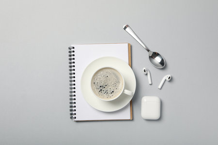 Concept of freelance, composition with hot drink and headphonesの写真素材