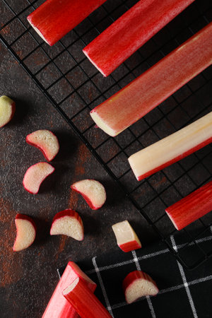 Rhubarb stalk on grill on dark background, top viewの写真素材