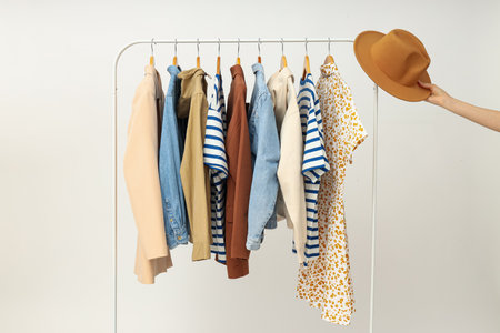 Wardrobe rack with different clothes, concept of different clothes