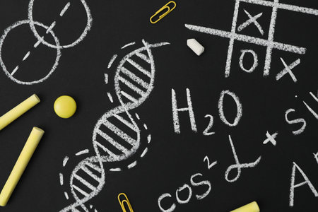 School formulas and drawings on a black school boardの写真素材