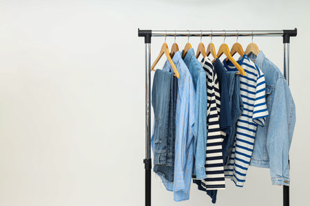 Wardrobe rack with different clothes, concept of different clothesの写真素材