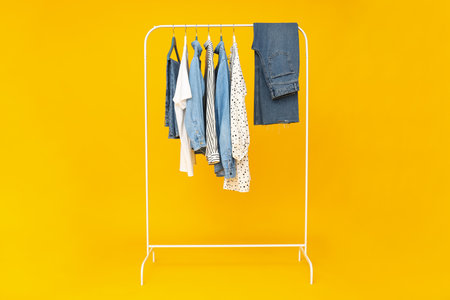 Wardrobe rack with different clothes, concept of different clothesの写真素材
