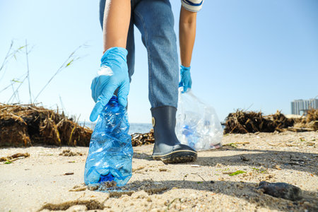 People clean up garbage on the banks of the river, environmental protection