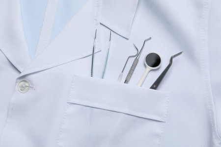 Medical tools in the pocket of a medical gownの写真素材