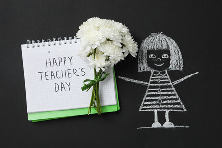 The inscription of congratulations on a notepad on the occasion of Teacher's Dayの写真素材