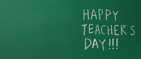 Happy teacher's day greetings, inscription on a green boardの写真素材