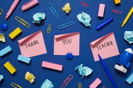 Stickers with inscriptions "Thank you teacher" on a blue background, with stationeryの写真素材