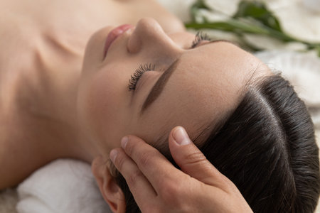 Concept of spa, relax and self care with beautiful young womanの写真素材