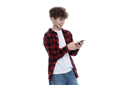 PNG,happy teenager with phone in hands, isolated on white backgroundの写真素材