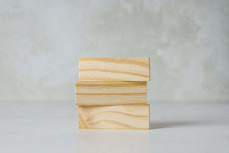 Wooden rectangles on light background, space for text
