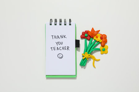 The inscription in the notebook: "Thank you, teacher!" with smileyの写真素材