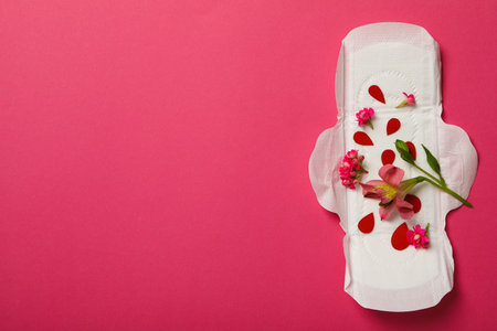 Menstrual pad with flowers on a pink backgroundの写真素材