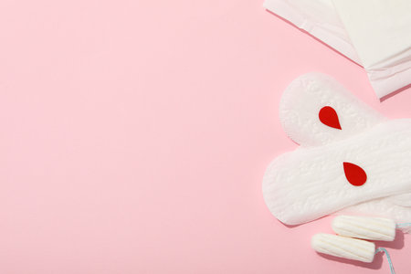 Menstrual feminine hygiene products on a pink backgroundの写真素材