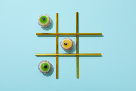 Game with jelly eyes on blue background, top viewの写真素材