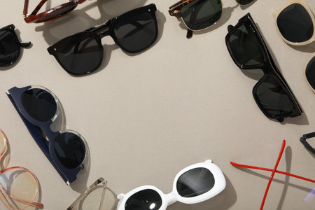 Many sunglasses on light background with space for textの写真素材