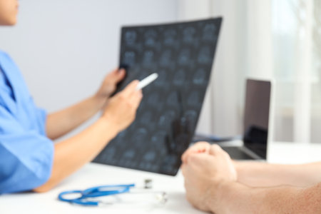 MRI images of a human head in the hands of a doctor