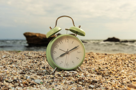 Clock, alarm clock, on the seashore, close-up