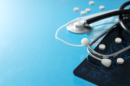 MRI or magnetic resonance imaging of human brain with stethoscope and pills. Place for textの写真素材