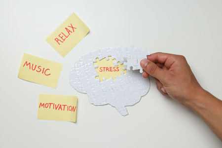 Puzzle, papers with words and hand on white background, top viewの写真素材