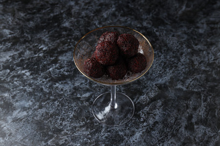 Brigadeiro in cocktail glass on dark backgroundの写真素材