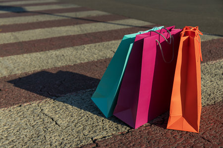 Colorful shopping bags on the road in the cityの写真素材