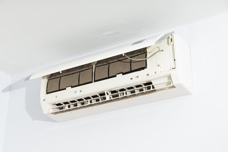 Air conditioner with dirty filter in living roomの写真素材
