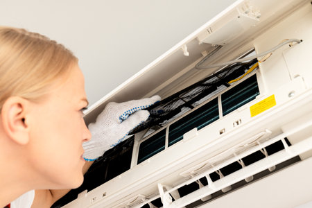 Female master and air conditioner, air conditioner repairの写真素材