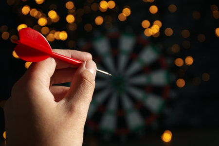 Darts hitting the target game at the party.