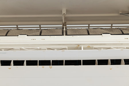 Air conditioner with dirty filter in living roomの写真素材
