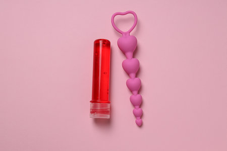 Lubricant with anal balls on a pink backgroundの写真素材