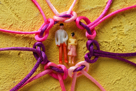 Braided multi-colored cords, painted tied together. The concept of creative cooperation and...