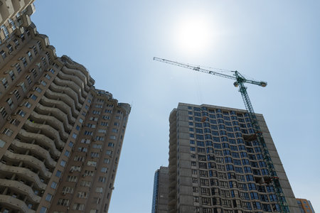 High-rise building in the city, construction on a sunny day