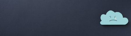 Paper cloud with sad emoji on dark blue background, space for textの写真素材