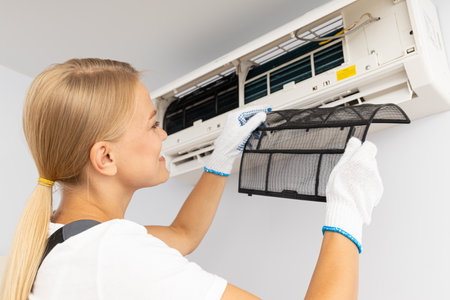 Female master and air conditioner, air conditioner repairの写真素材