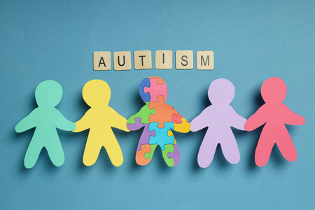 Paper figures of people on a light background. world autism day conceptの写真素材