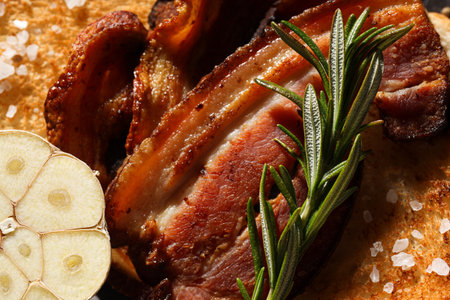 Tasty breakfast and delicious meat food concept - fried baconの写真素材