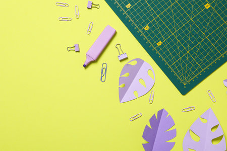 Patchwork accessories concept on yellow background, mat cuttingの写真素材