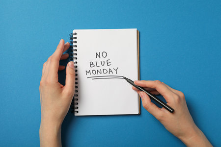 Notepad with text No blue Monday and marker in female hands, top viewの写真素材