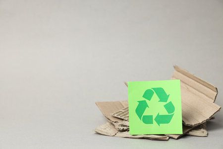 Sign of recycling of kraft cardboard, environmental protection. smart use of resources.の写真素材