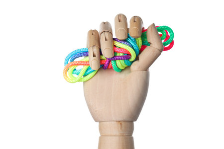 PNG,a knot of colorful laces in a wooden hand, isolated on white background