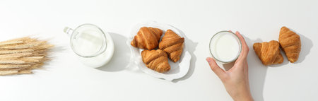 Breakfast tasty food concept - milk with bakery productsの写真素材