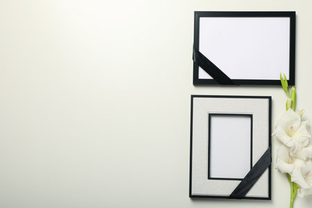 Photo frames and flowers on white background, space for textの写真素材