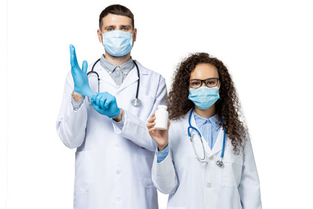 Male and female doctors in white uniform, isolated on white background